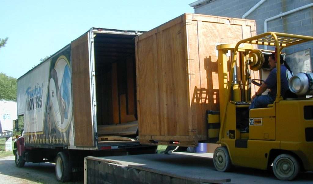 Forklift Loading a Truck for Moving Service
