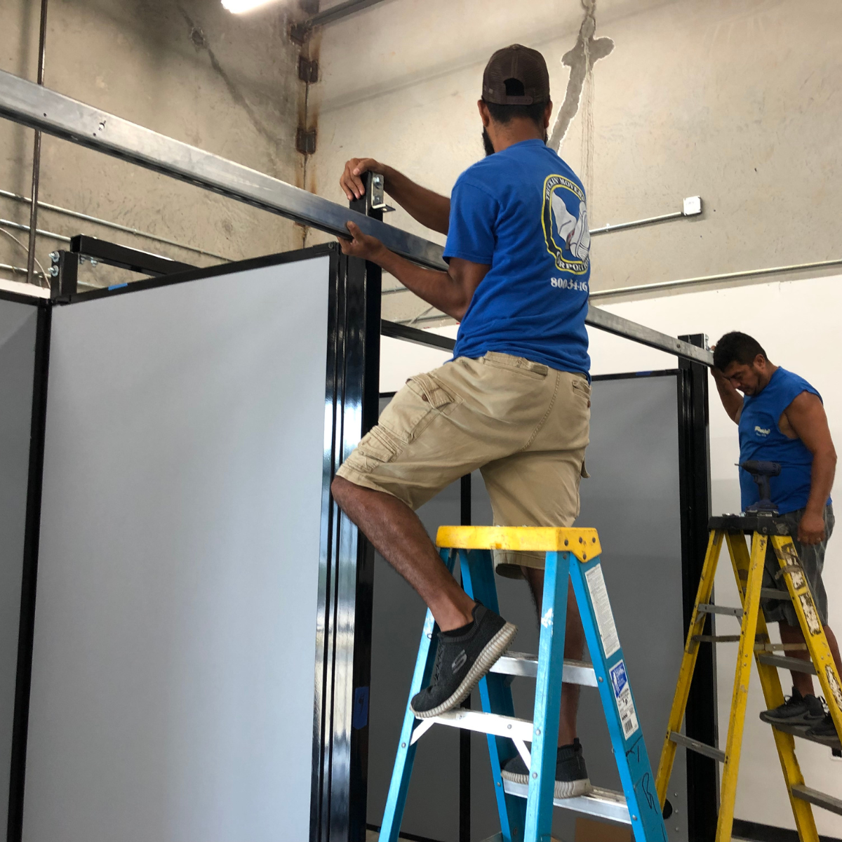 Movers working in uninstalling furniture