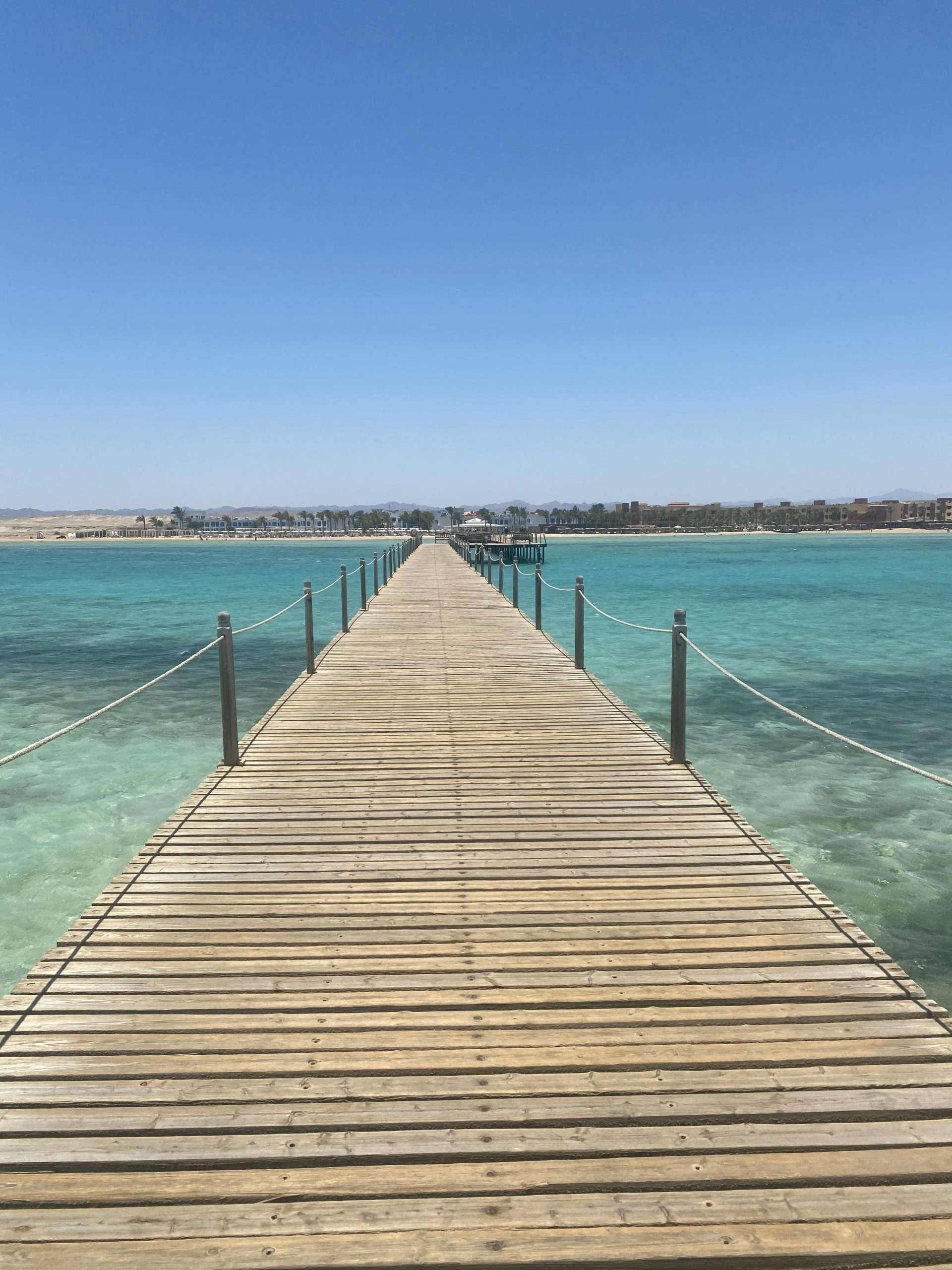 pexels-milan-wouters-1903731614-29116365 A wooden pier extends into the ocean